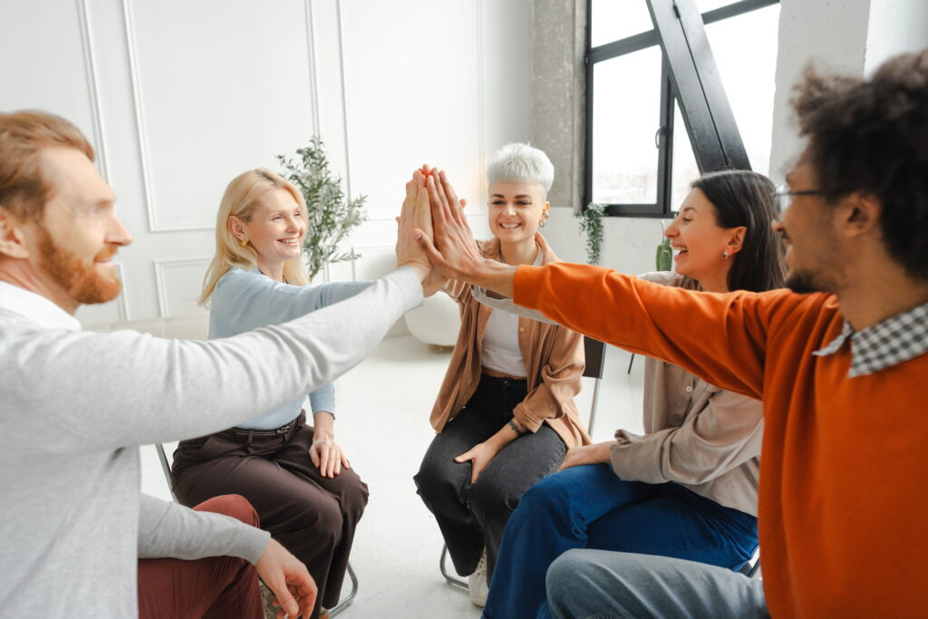 People enjoy a group therapy exercise as part of Depression Treatment in Alpharetta, GA.