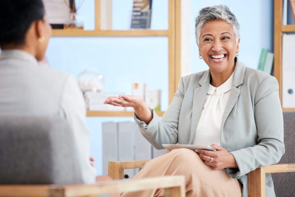 A woman talks to her therapist about dual diagnosis options for treatment during Depression Treatment in Alpharetta, GA.