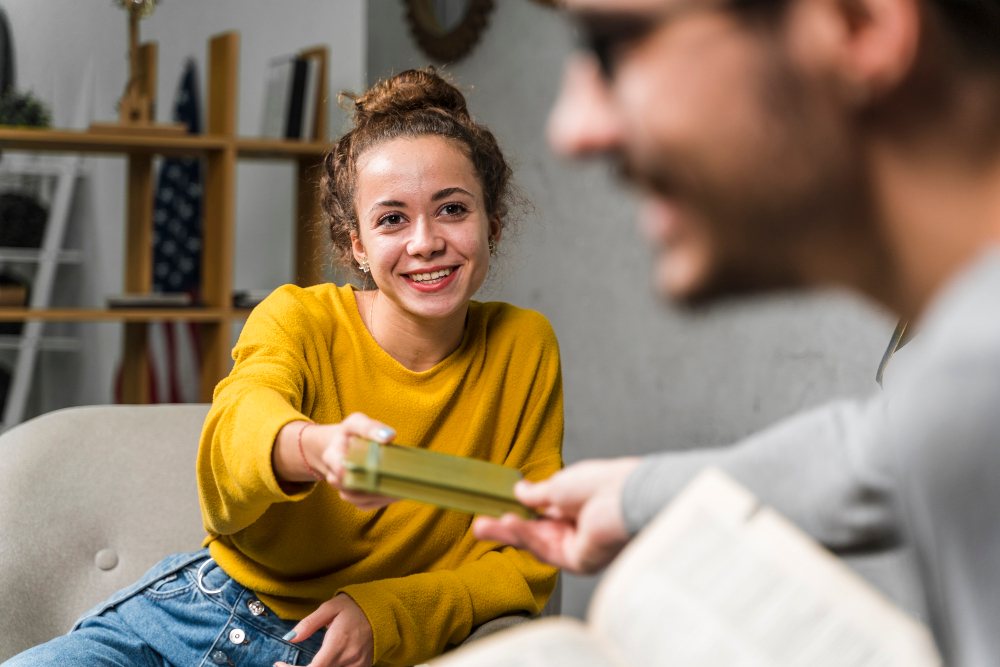Patient receiving a book from a therapist during treatment at an eating disorder treatment center in Alpharetta, GA.