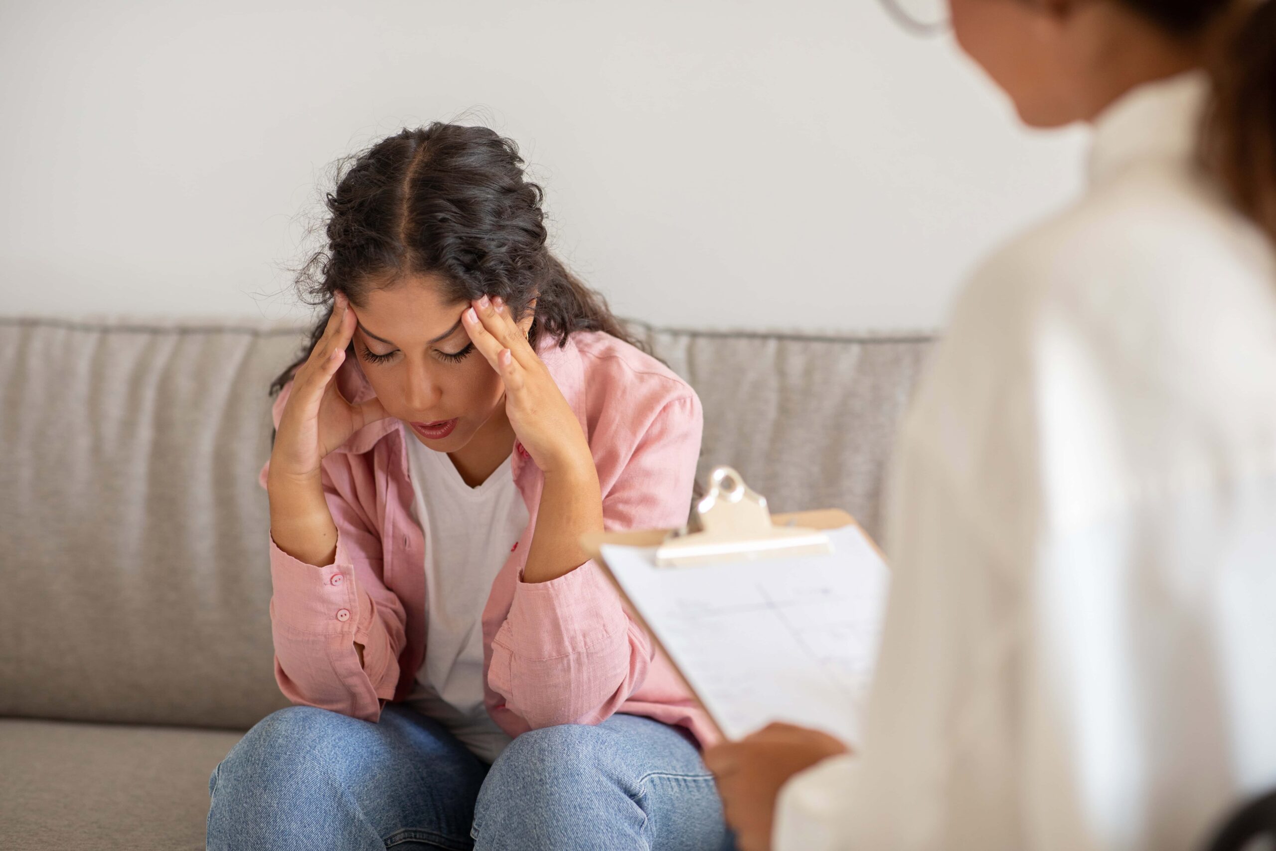 Patient discussing emotional challenges with a therapist during mental health counseling in Alpharetta, GA.