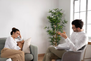 Young person talking with a specialist during mental health treatment in Marietta, GA at Emerge Healing Center.