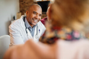 African American doctor providing compassionate care during treatment at Emerge Healing Centers near Duluth, GA.
