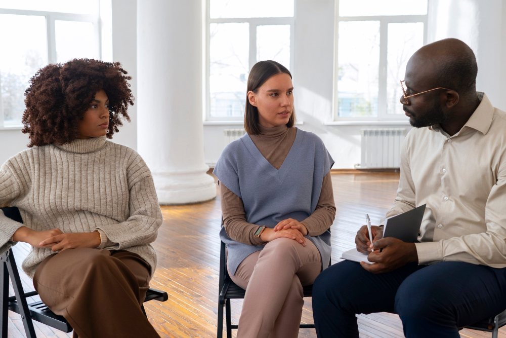 People sharing feelings during a group session as part of IOP addiction treatment.