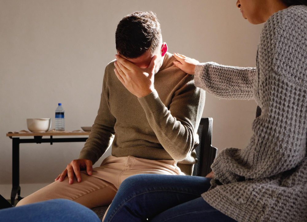 Man receiving compassionate support during dual diagnosis treatment in Alpharetta, GA.