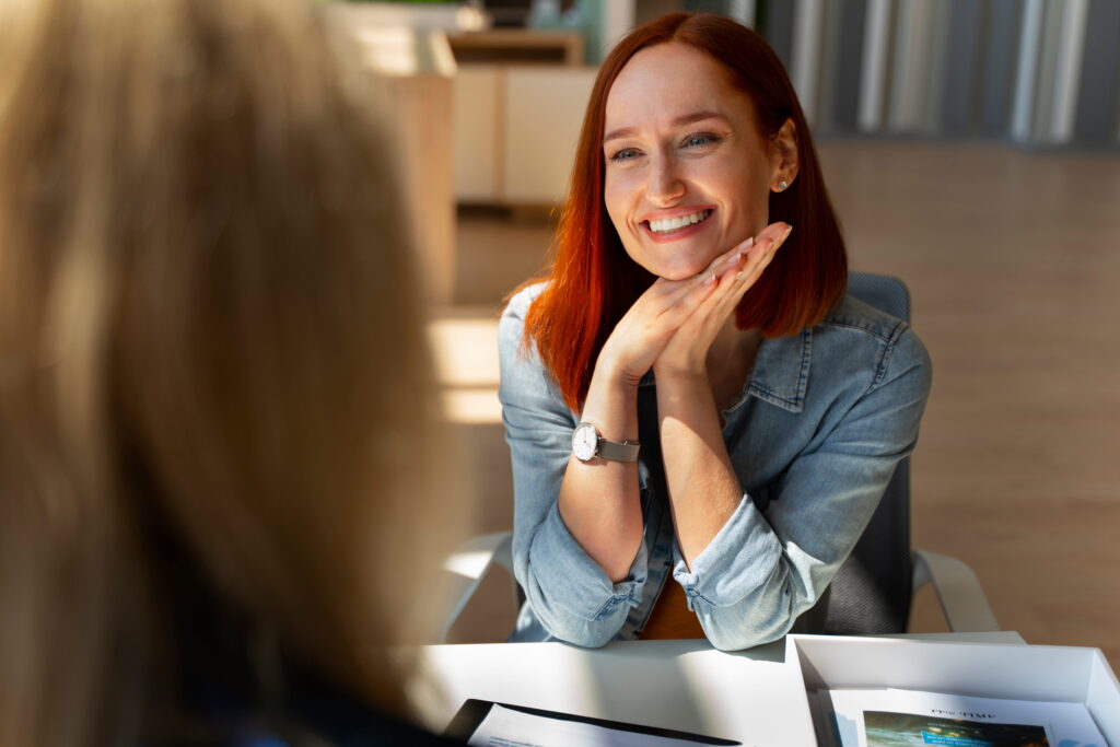 A woman talks to her doctor about insurance options during Aetna Rehab in Alpharetta, GA.