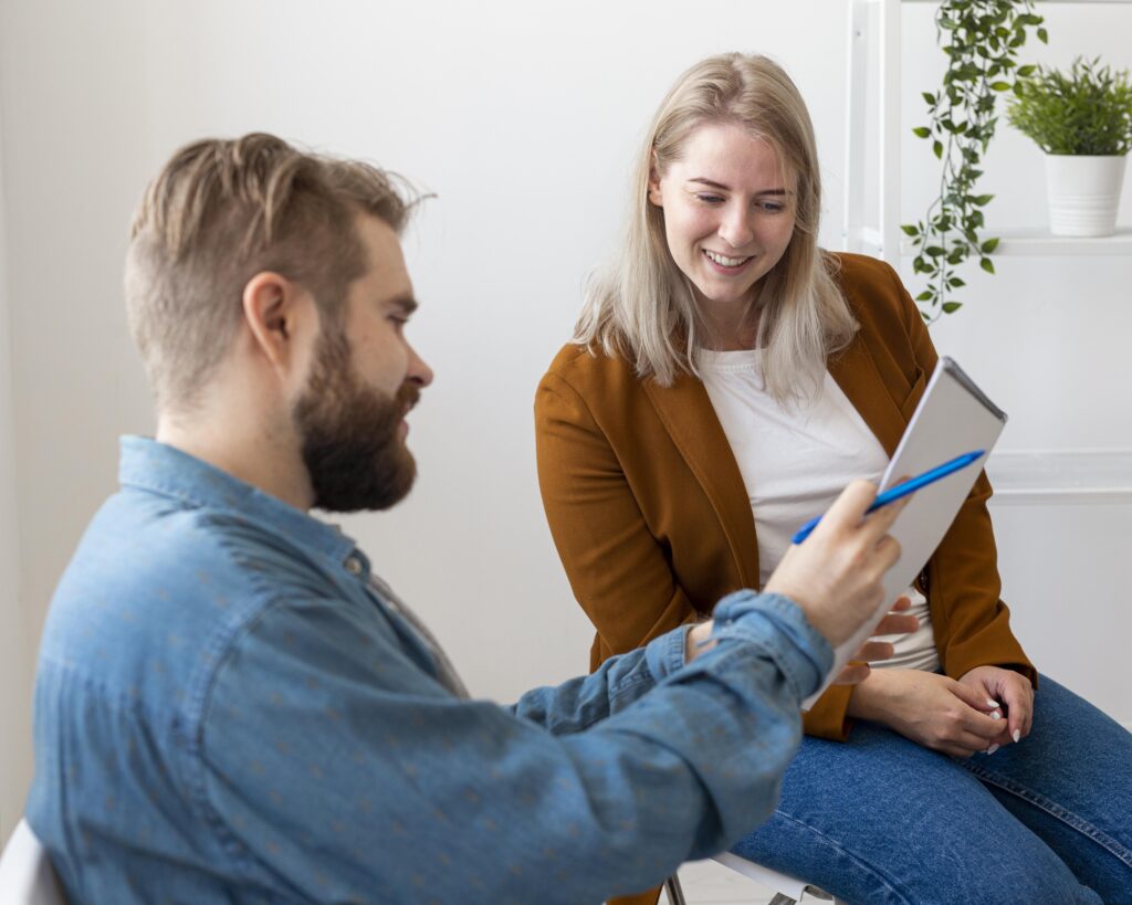 A woman talks to her therapist about BCBS Rehab in Alpharetta, GA.