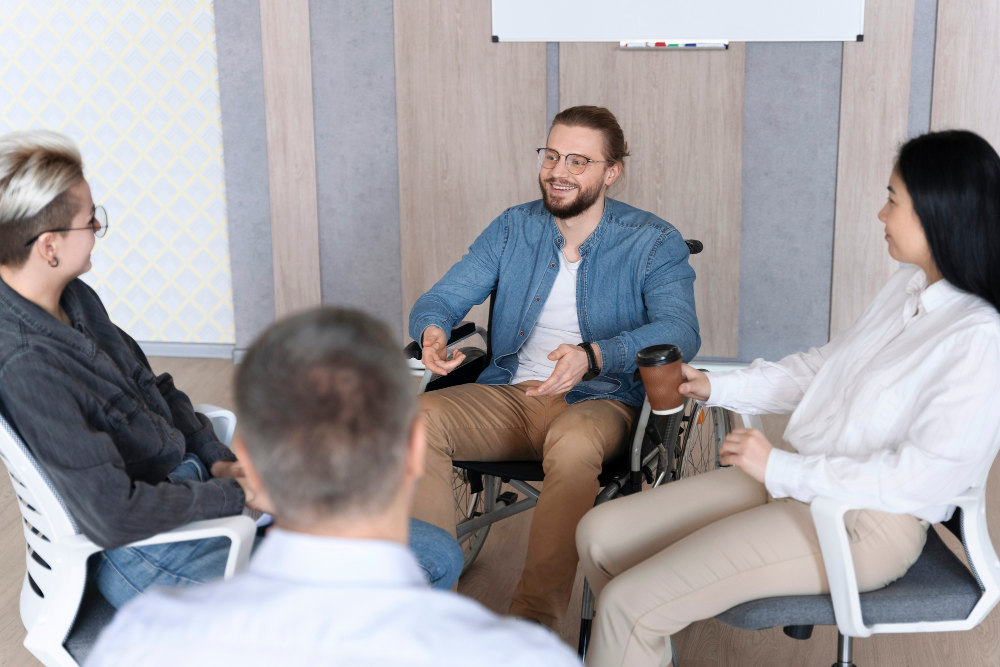 People participating in a group therapy session to learn how IOP addiction treatment works.