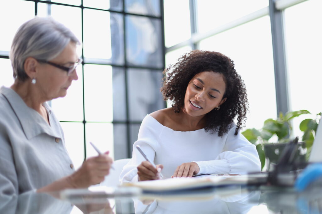 A woman checks her insurance benefits to get afforable treatment through United Healthcare Rehab in Alpharetta, GA.